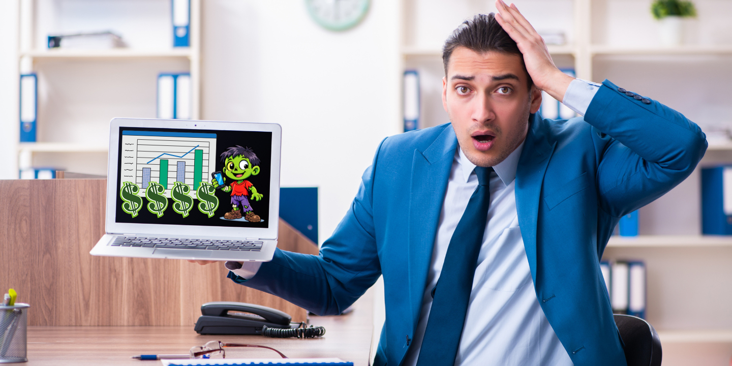 business man surprised by hidden fees represented on laptop with zombie cartoon and dollar signs
